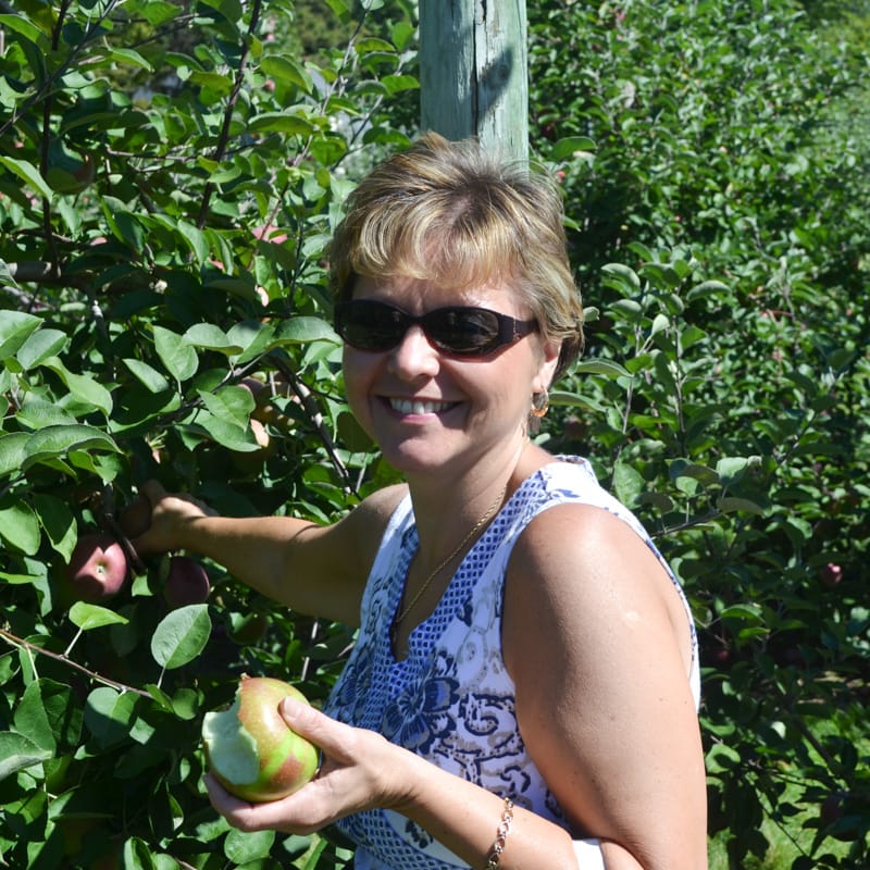 Peg Stansfield picking apples