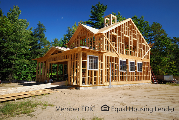 This is a picture of a wooden house frame - with the FDIC Equal Housing Lender logo at the bottom