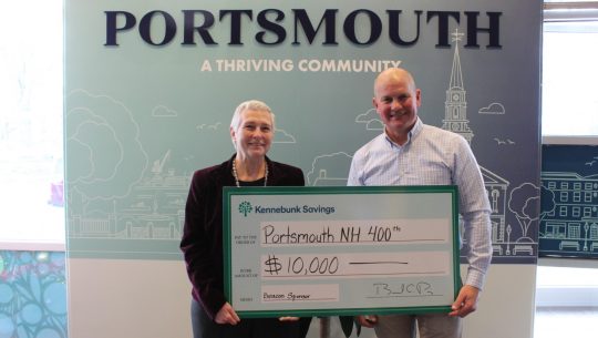 Chris Kehl poses with PNH400 Managing Director Valerie Rochon with a check for $10,000