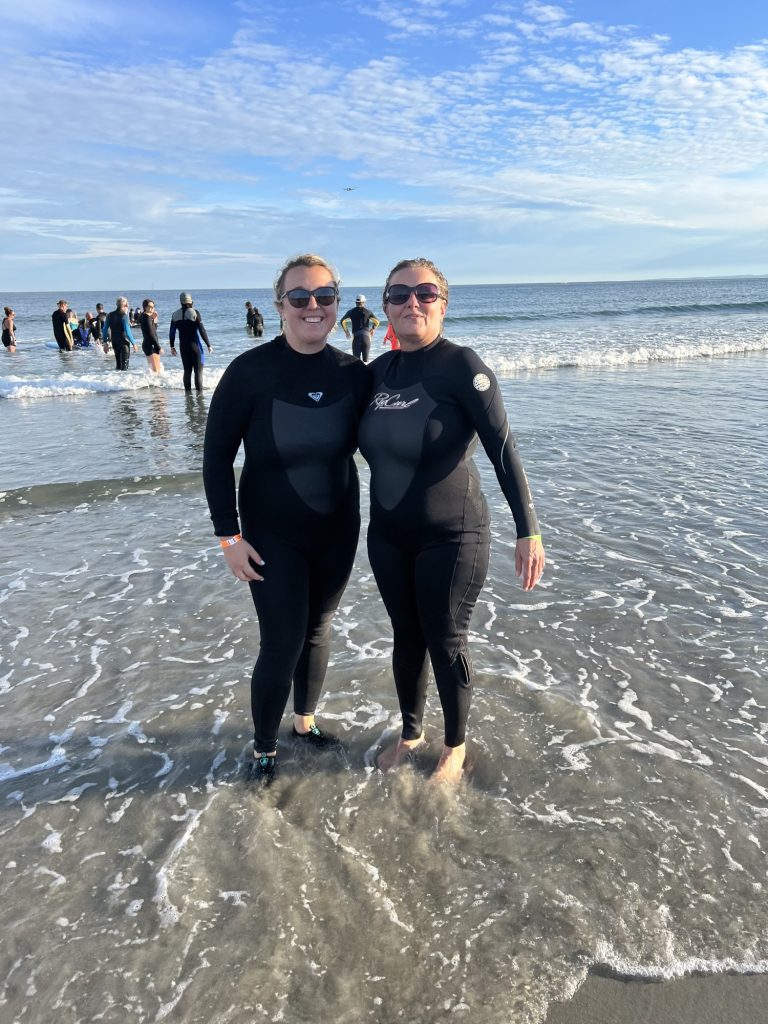 Kennebunk Savings Employees Jess Owens and Nancy Caron volunteer at a Special Surfers event